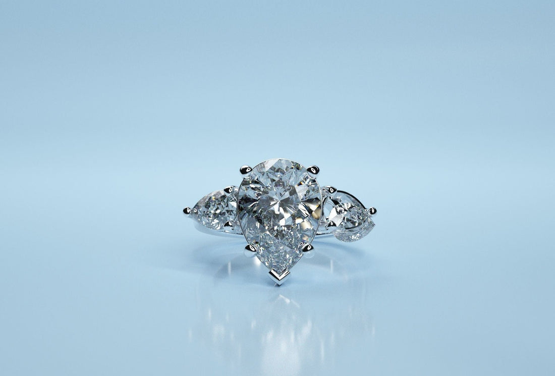 Pear diamond trio engagement ring