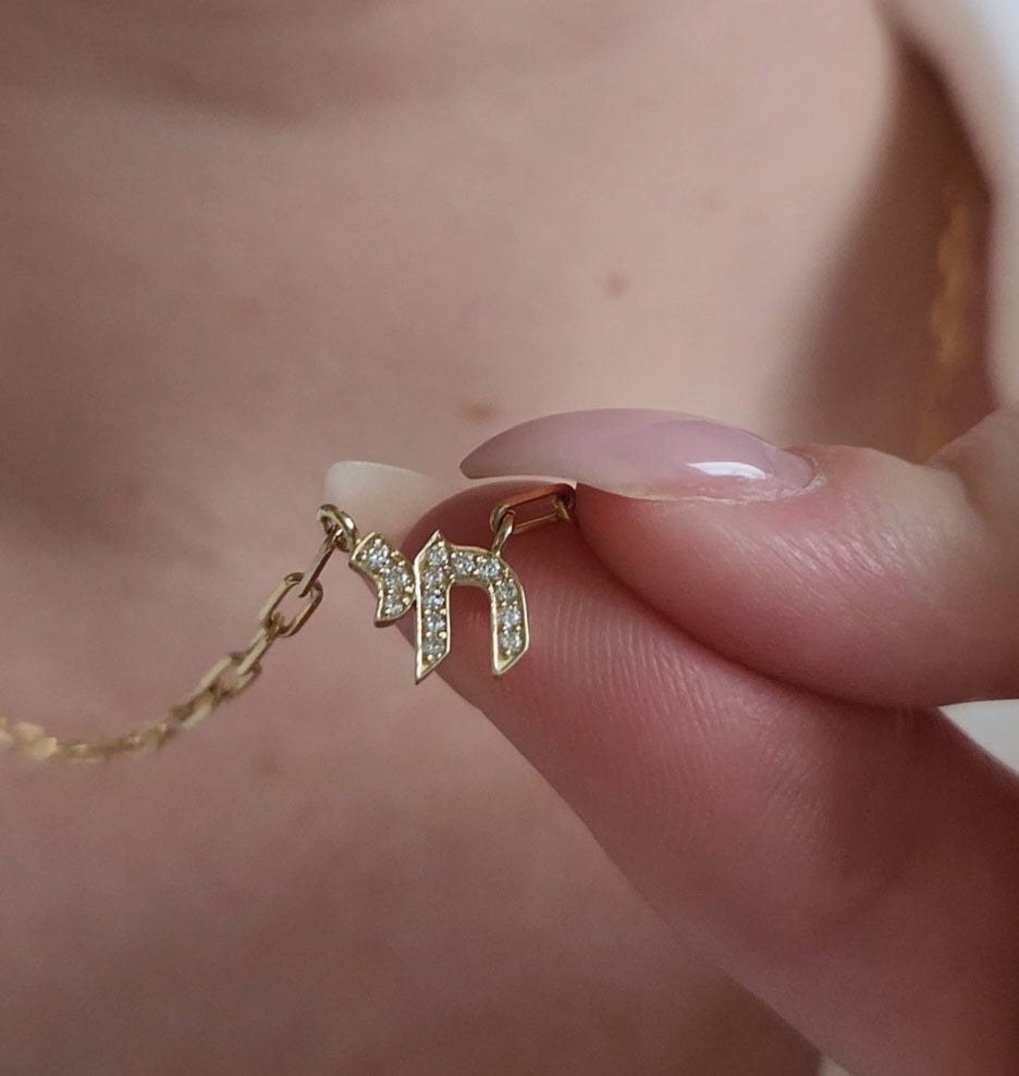 Chai Diamond Necklace in 14K yellow gold, a Hebrew Chai pendant on a paperclip chain by Margaret Krinetz
