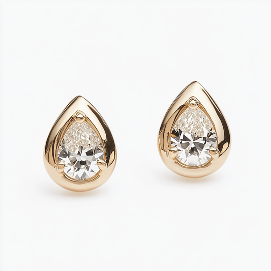 Baby Allure Tear Drop Studs, tiny tear drop stud earrings in 18K gold by Margaret Krinetz