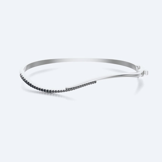 Wavy Black Diamond Bangle For Him, an 18K recycled gold bangle with black diamonds