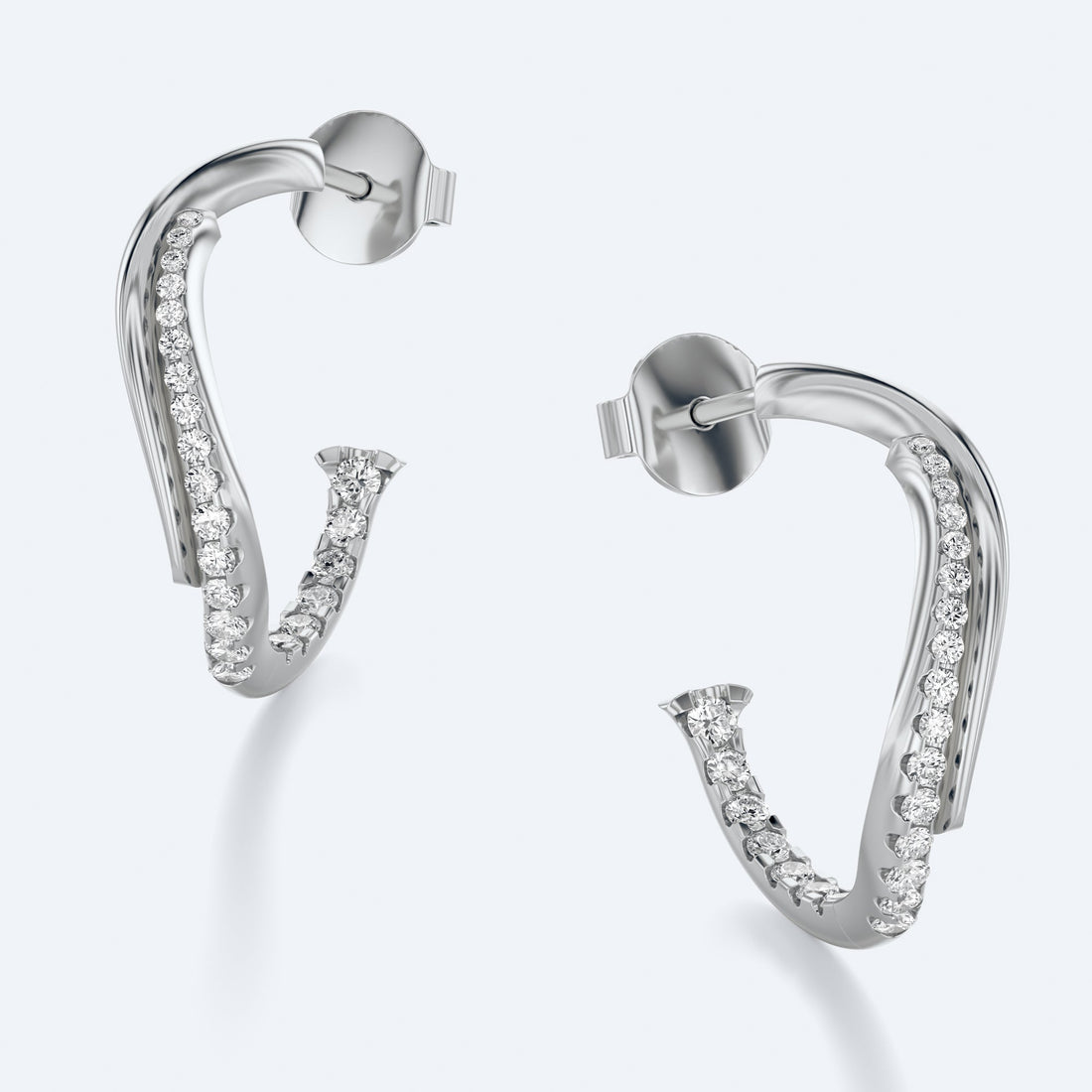 Wavy Diamond Hoop Earrings in 18K recycled gold with natural diamonds catching light, diamond sparkle in Miami sunlight