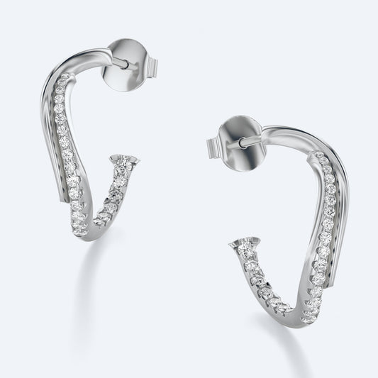 Wavy Diamond Hoop Earrings in 18K recycled gold with natural diamonds catching light, diamond sparkle in Miami sunlight